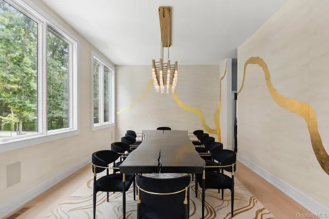 a view of a dining room with furniture and window