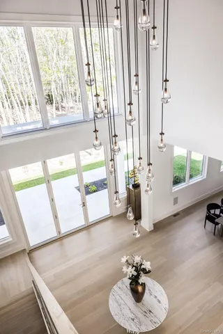 a living room with furniture and a floor to ceiling window