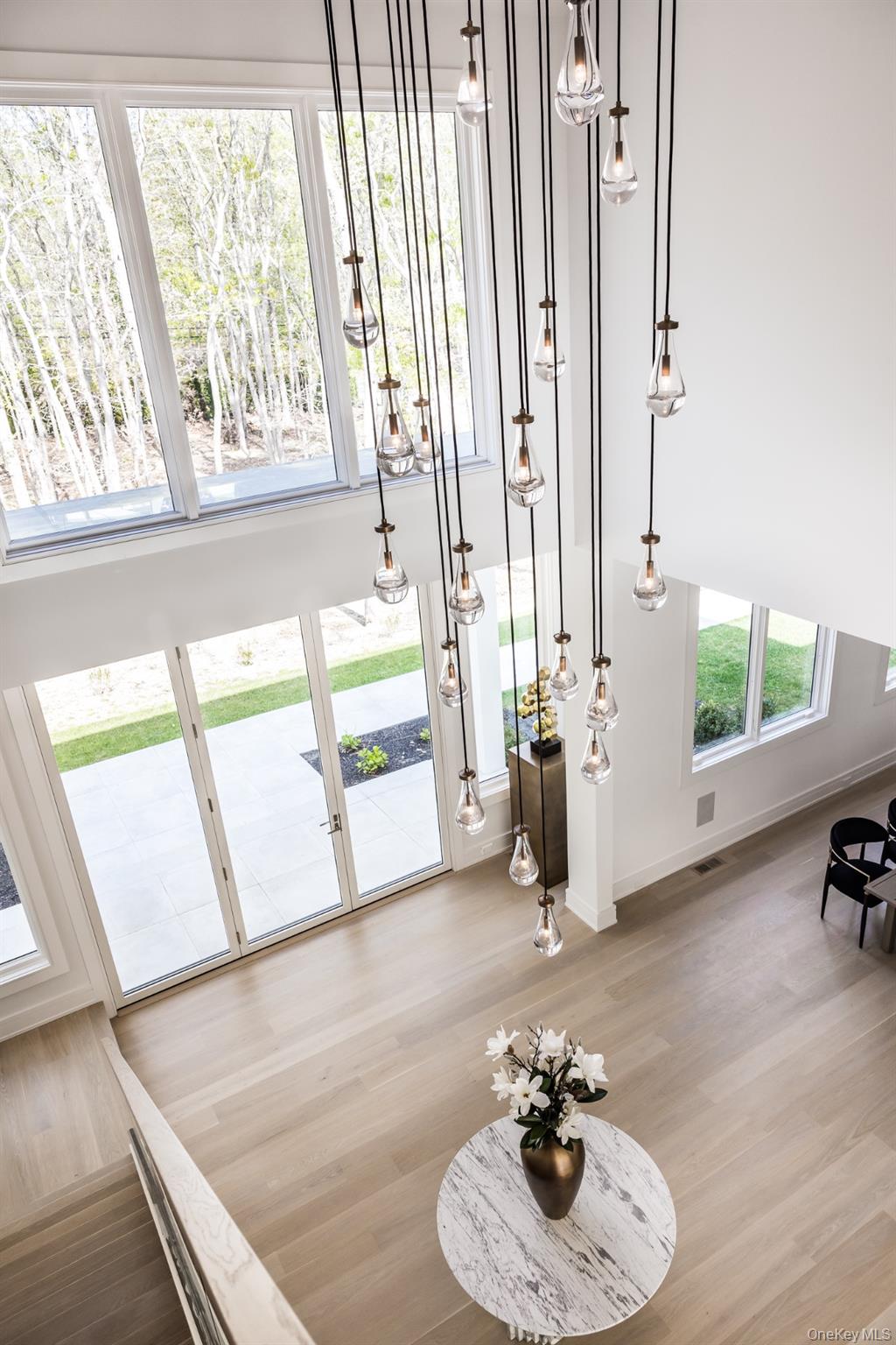 1552 Deerfield Road Water Mill, NY 11976 - Photo 18 of 37 a living room with furniture and a floor to ceiling window