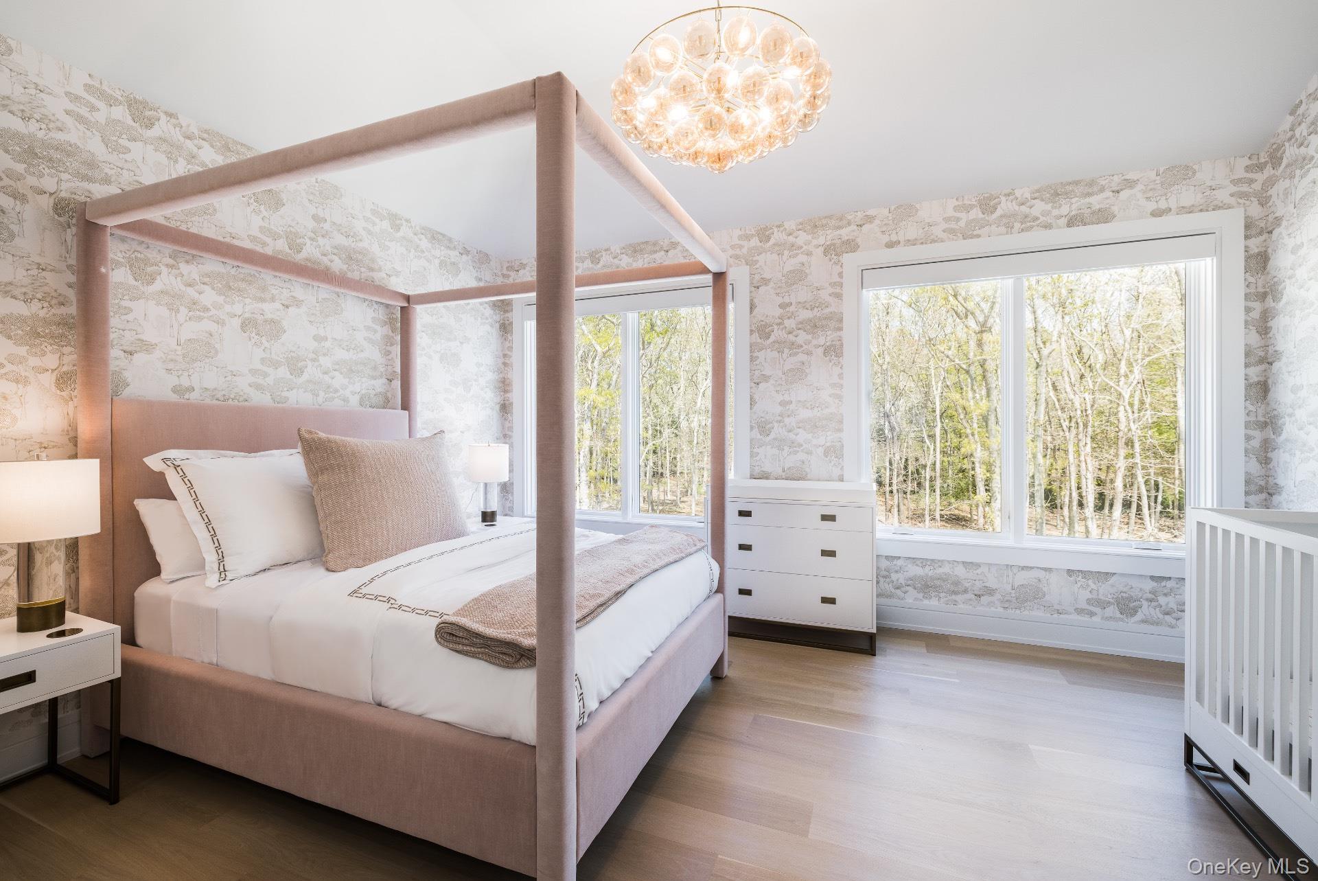 1552 Deerfield Road Water Mill, NY 11976 - Photo 21 of 37 a spacious bedroom with a bed and a large window