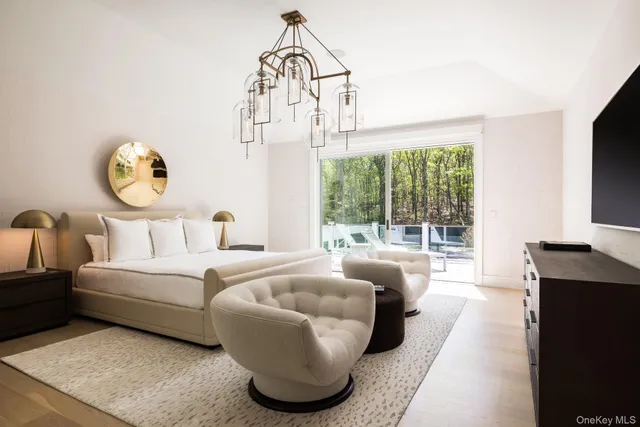 a bedroom with a bed and a couch