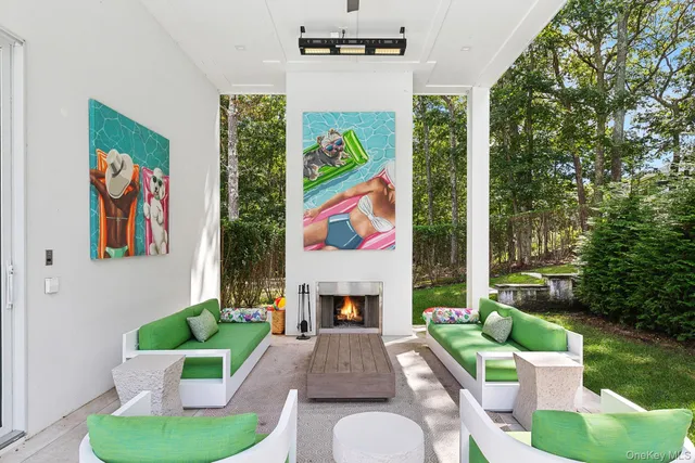 a living room with furniture fireplace and garden