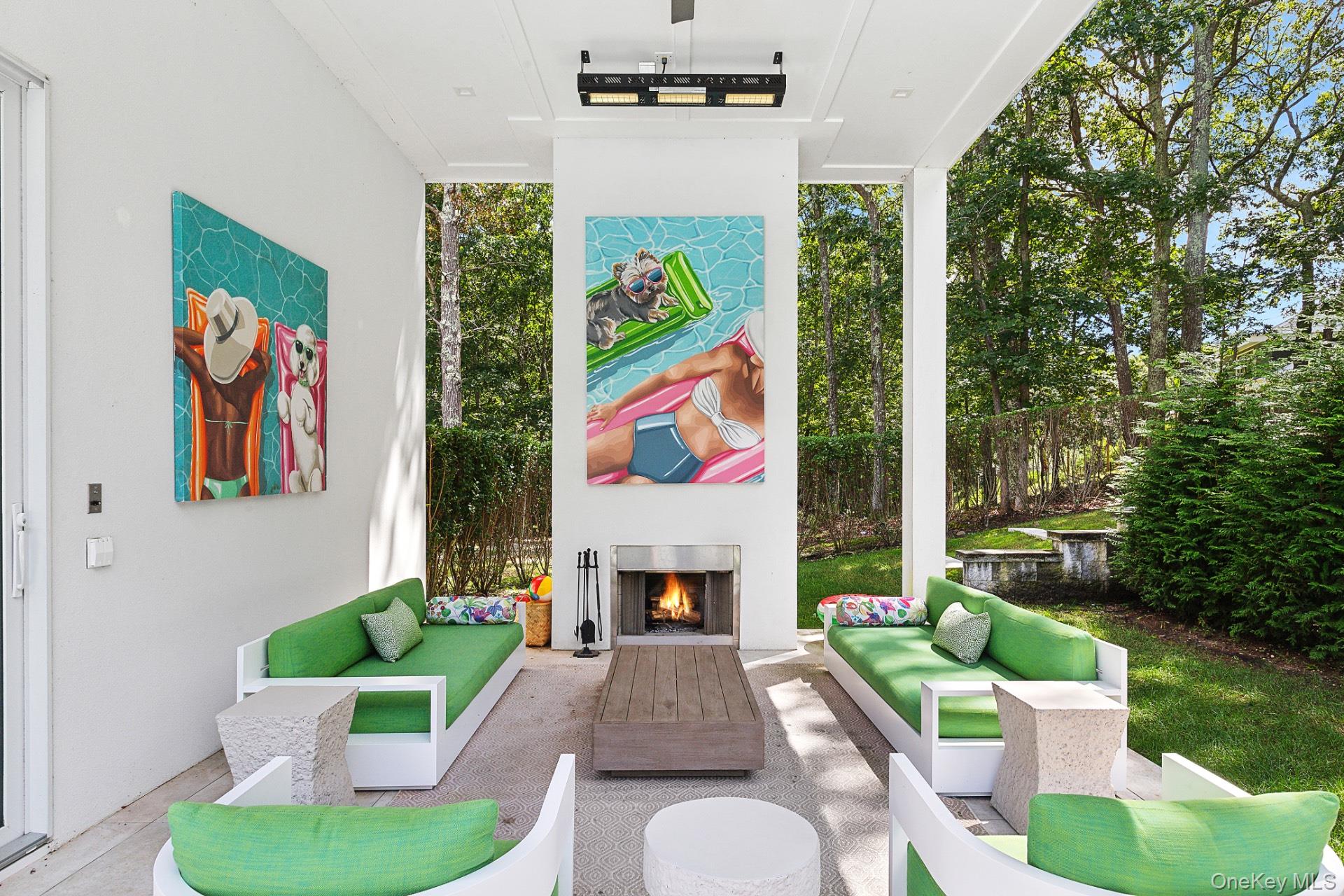 1552 Deerfield Road Water Mill, NY 11976 - Photo 5 of 37 a living room with furniture fireplace and garden