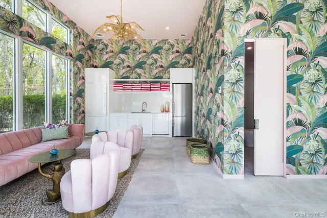 a bath room with a couch and a potted plant