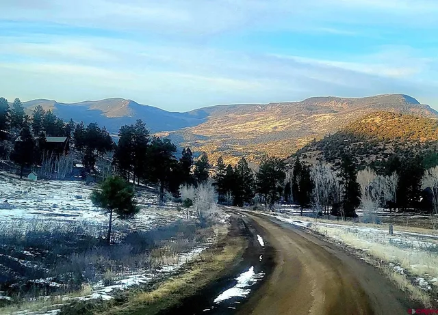a view of a town with mountains in the background