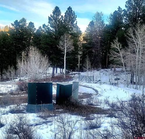 a view of a yard covered with snow