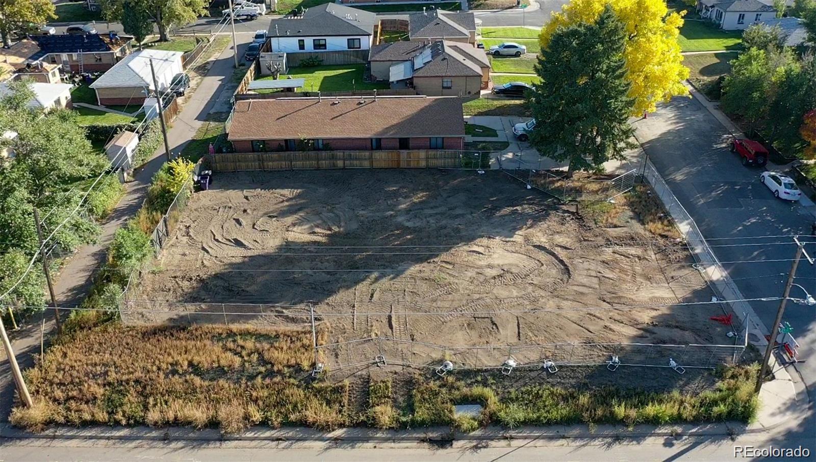 2882 Monroe Street Denver, CO 80205 - Photo 5 of 6 a view of a house with a yard