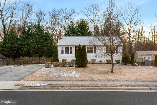 a house with trees in the background