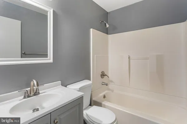 a bathroom with a sink toilet and bathtub