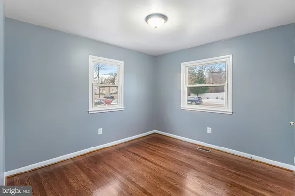 a view of room with wooden floor and window