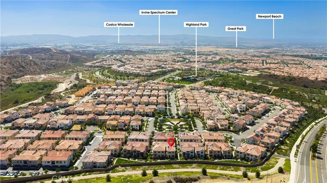 a view of kitchen with granite countertop sink and cabinets