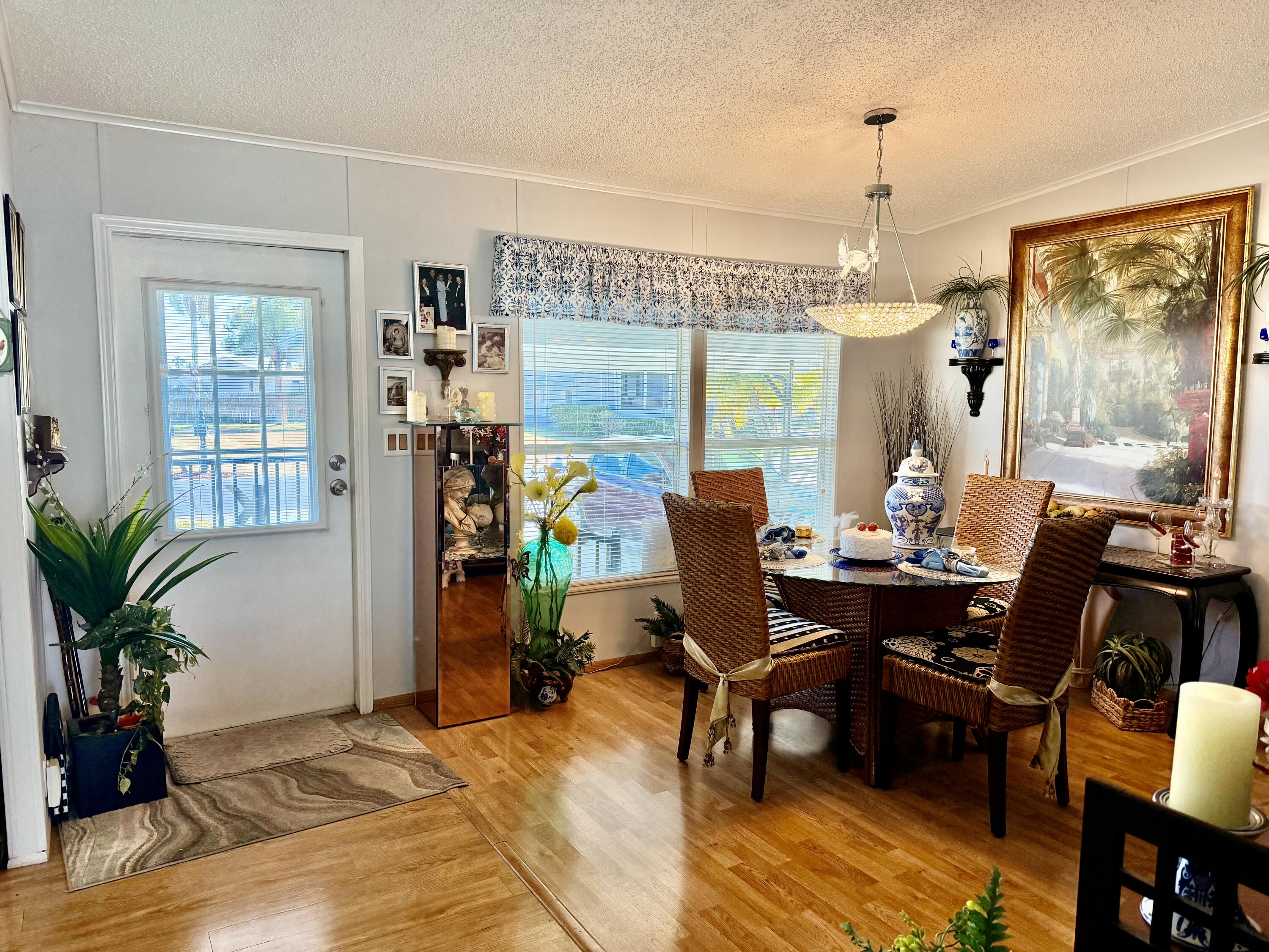 1692 Southwest 35th Circle Okeechobee, FL 34974 - Photo 12 of 30 a view of a dining room with furniture window and wooden floor