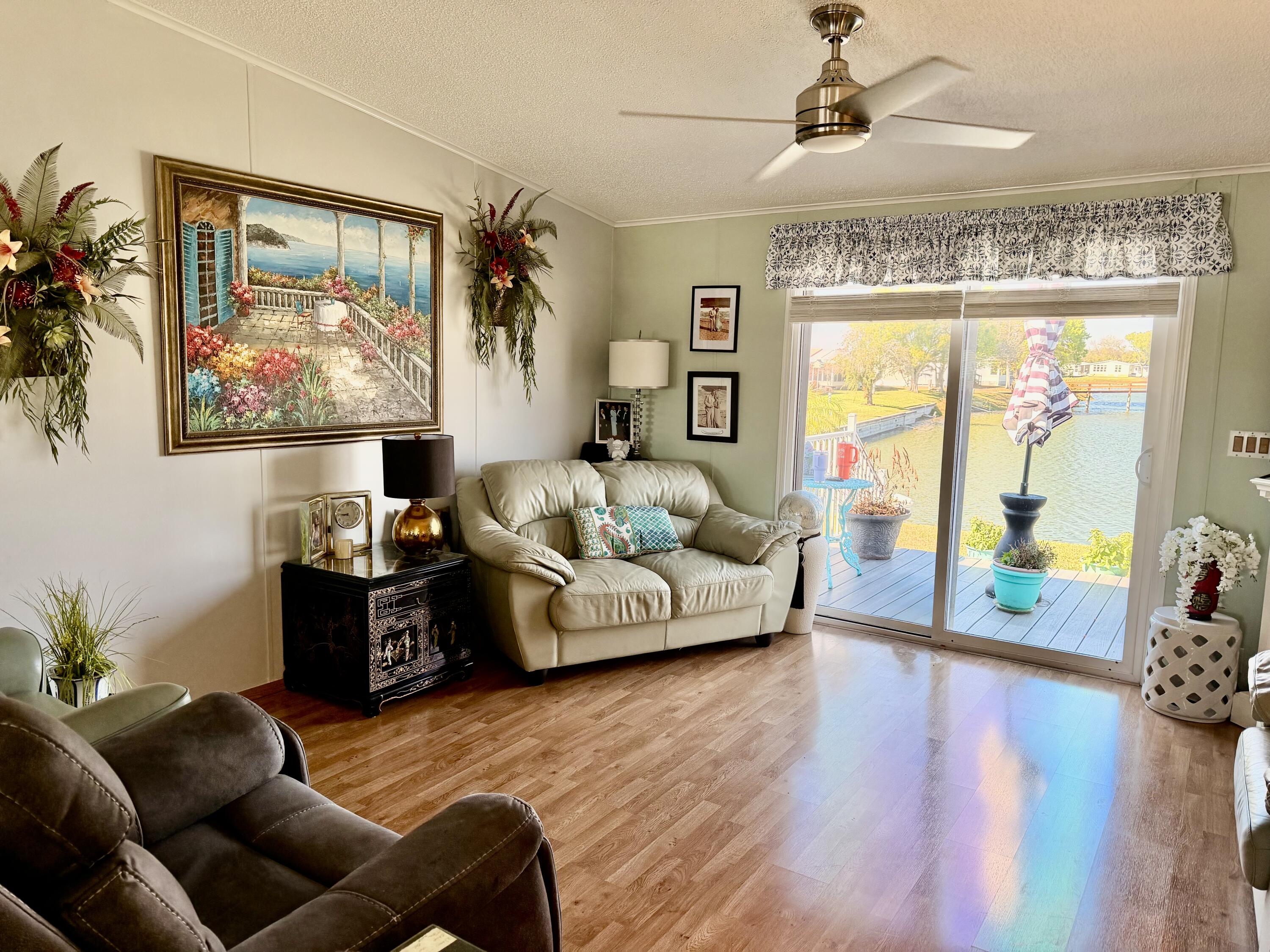 1692 Southwest 35th Circle Okeechobee, FL 34974 - Photo 15 of 30 a living room with furniture and a large window