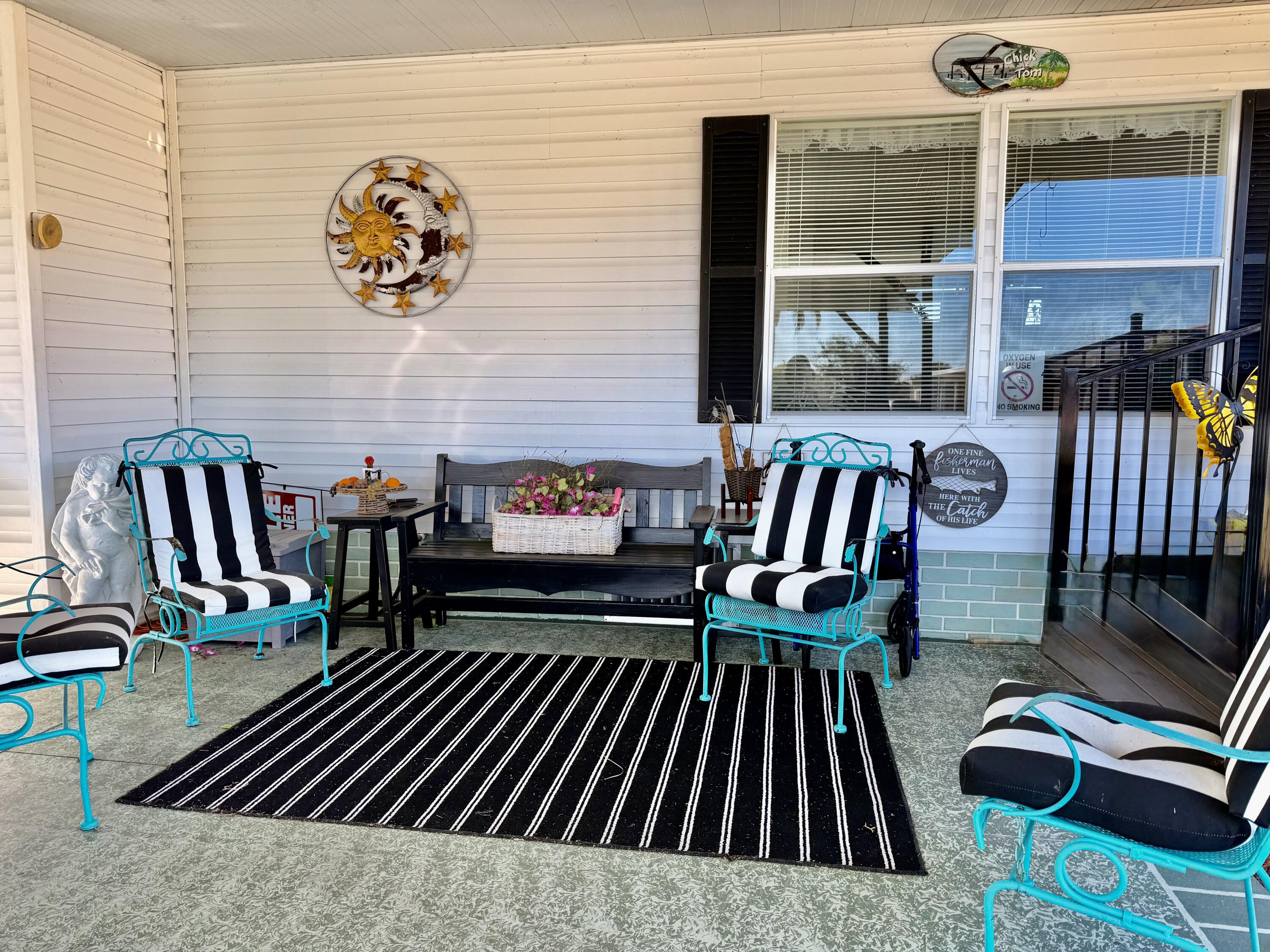 1692 Southwest 35th Circle Okeechobee, FL 34974 - Photo 17 of 30 a view of living room kitchen and patio