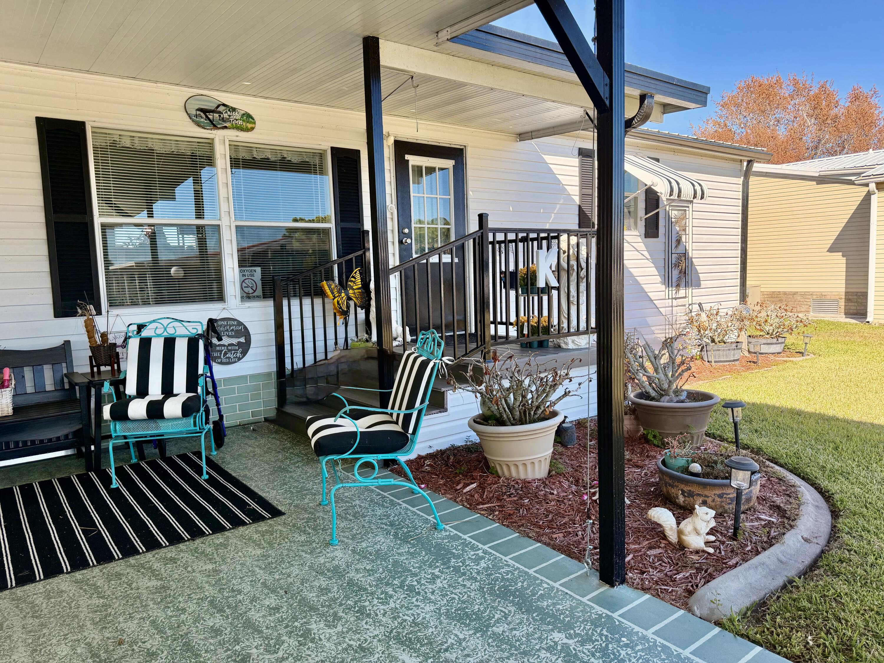 1692 Southwest 35th Circle Okeechobee, FL 34974 - Photo 21 of 30 a view of a porch with furniture and floor to ceiling window