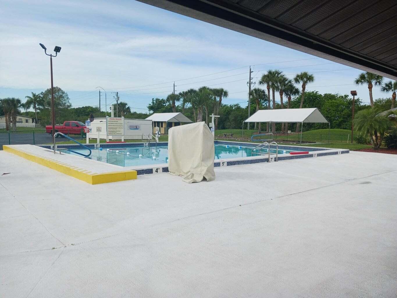 1692 Southwest 35th Circle Okeechobee, FL 34974 - Photo 28 of 30 a view of a backyard with potted plants