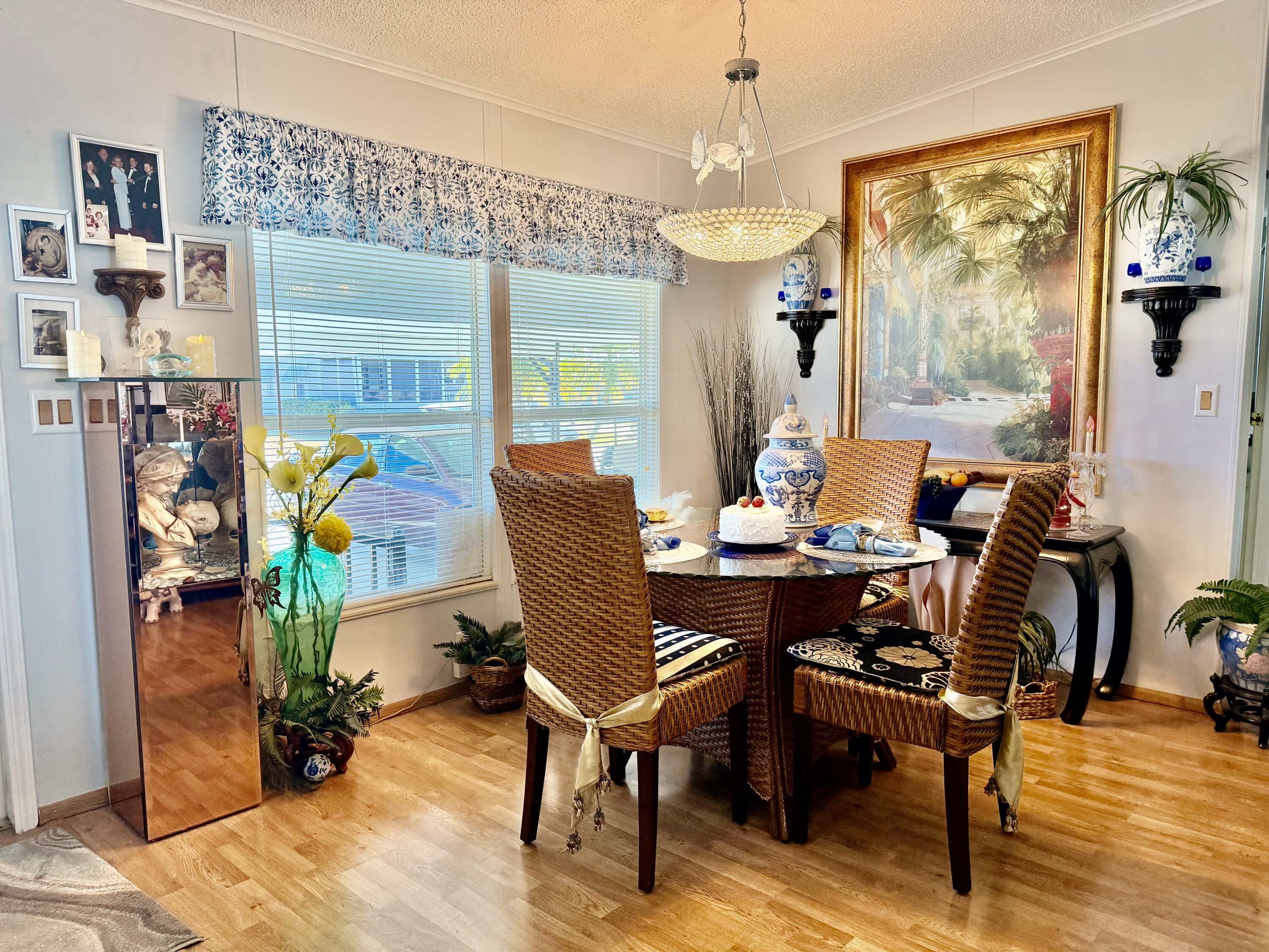 1692 Southwest 35th Circle Okeechobee, FL 34974 - Photo 6 of 30 a view of a dining room with furniture wooden floor and a chandelier