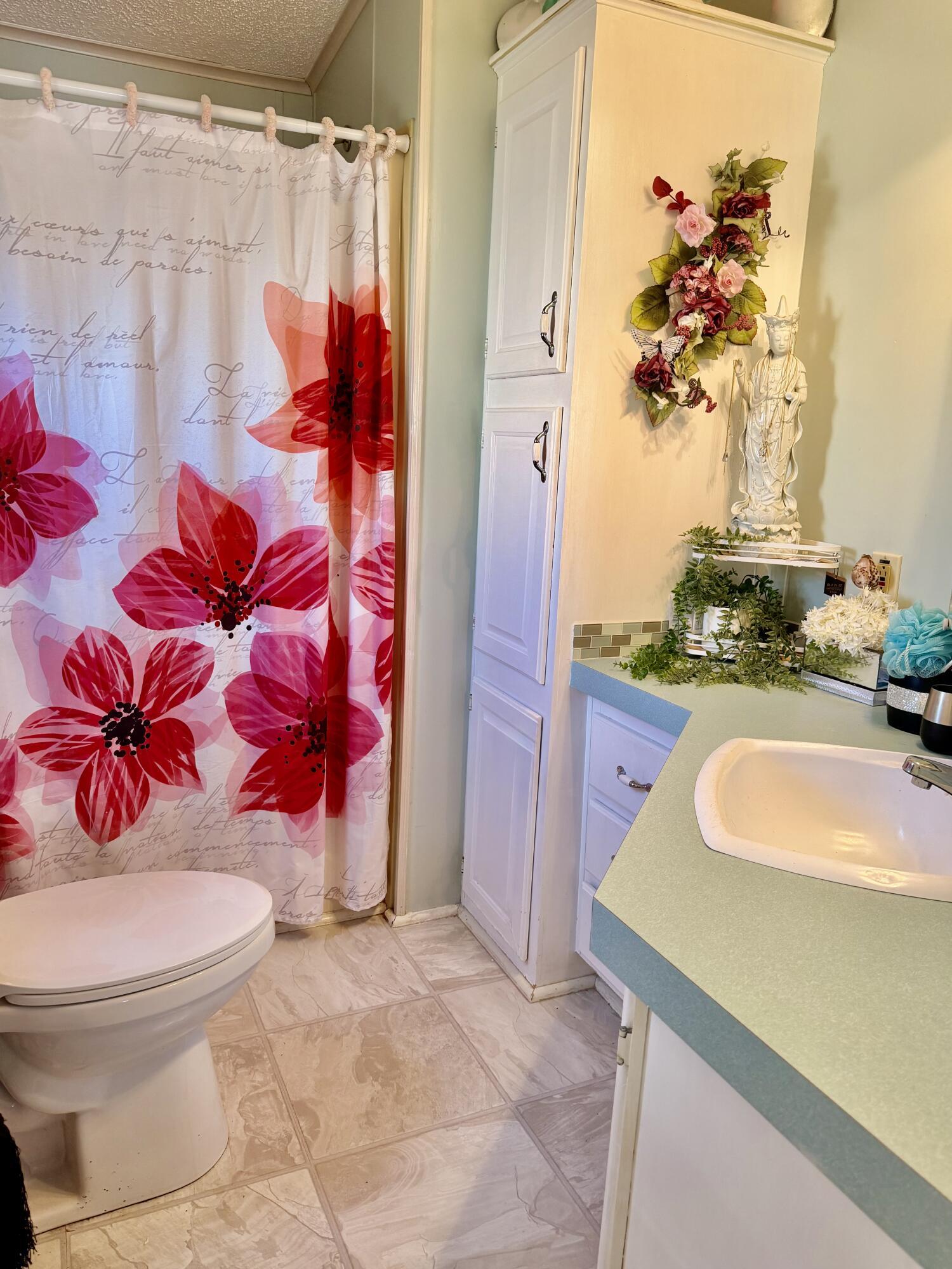 1692 Southwest 35th Circle Okeechobee, FL 34974 - Photo 8 of 30 a bathroom with a sink toilet and shower