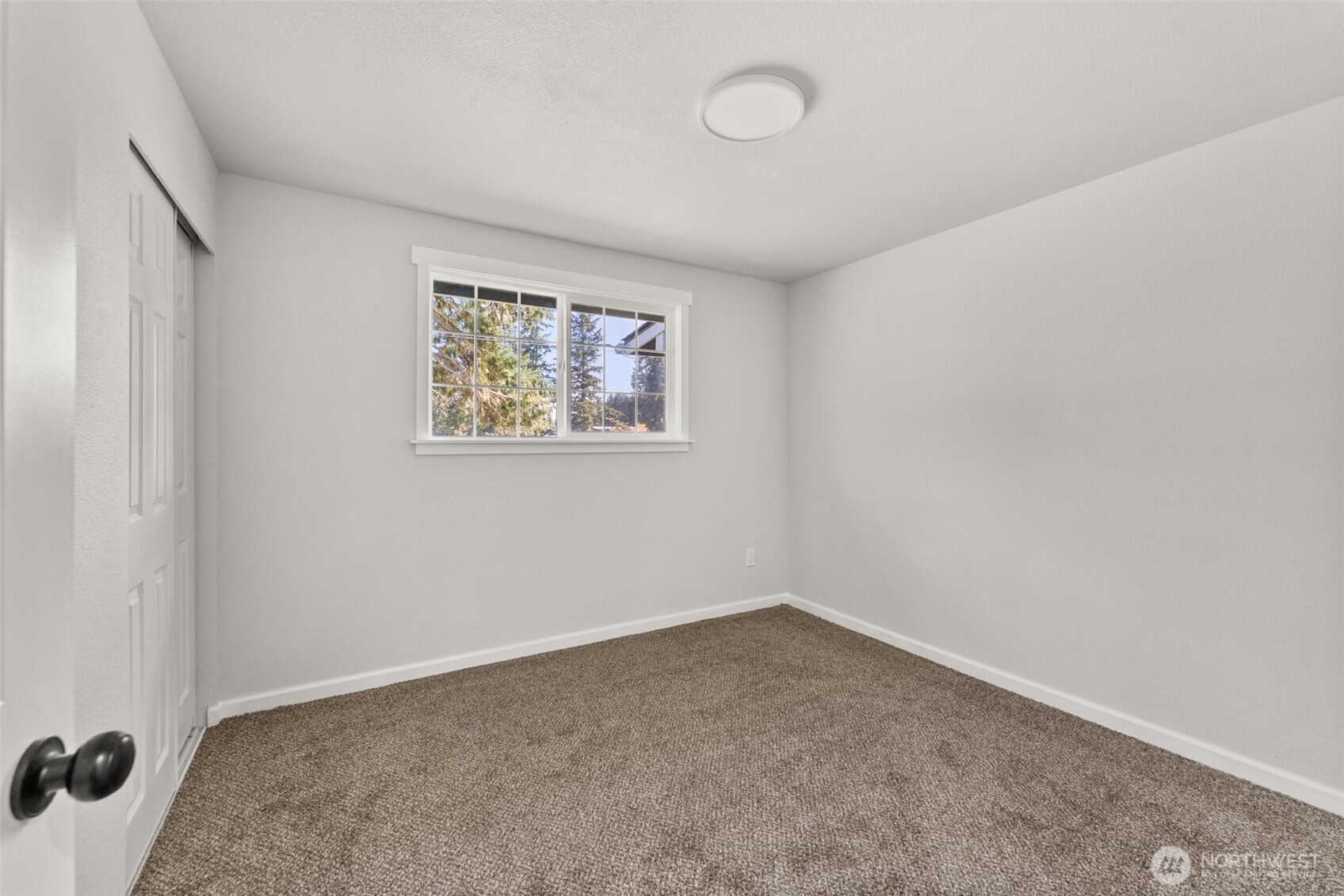 9037 178th Avenue Southwest Rochester, WA 98579 - Photo 13 of 33 an empty room with a window