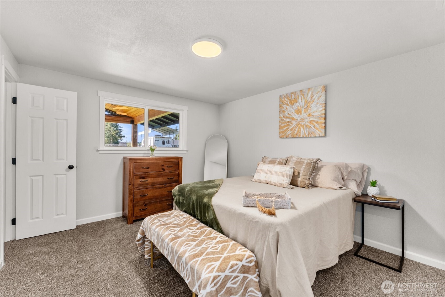 9037 178th Avenue Southwest Rochester, WA 98579 - Photo 16 of 33 a bedroom with a bed and painting on the wall