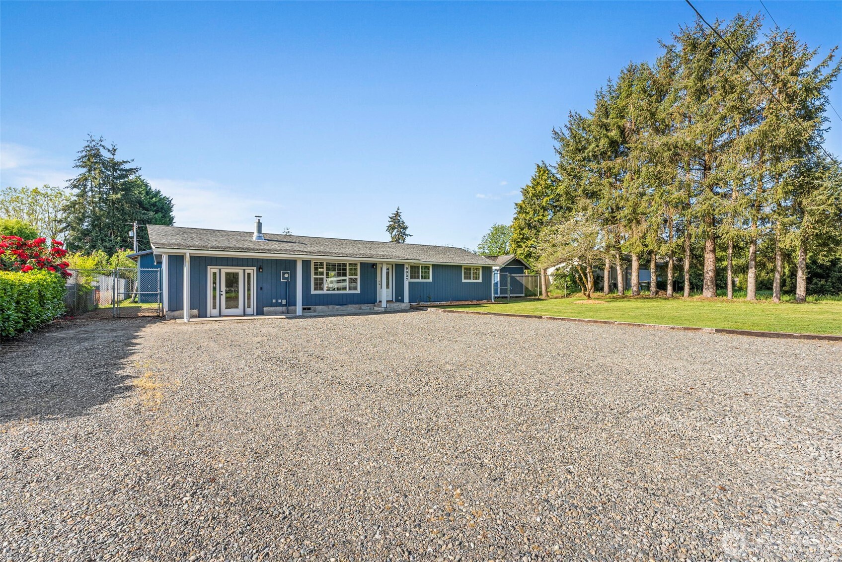 9037 178th Avenue Southwest Rochester, WA 98579 - Photo 2 of 33 a front view of house with yard and green space