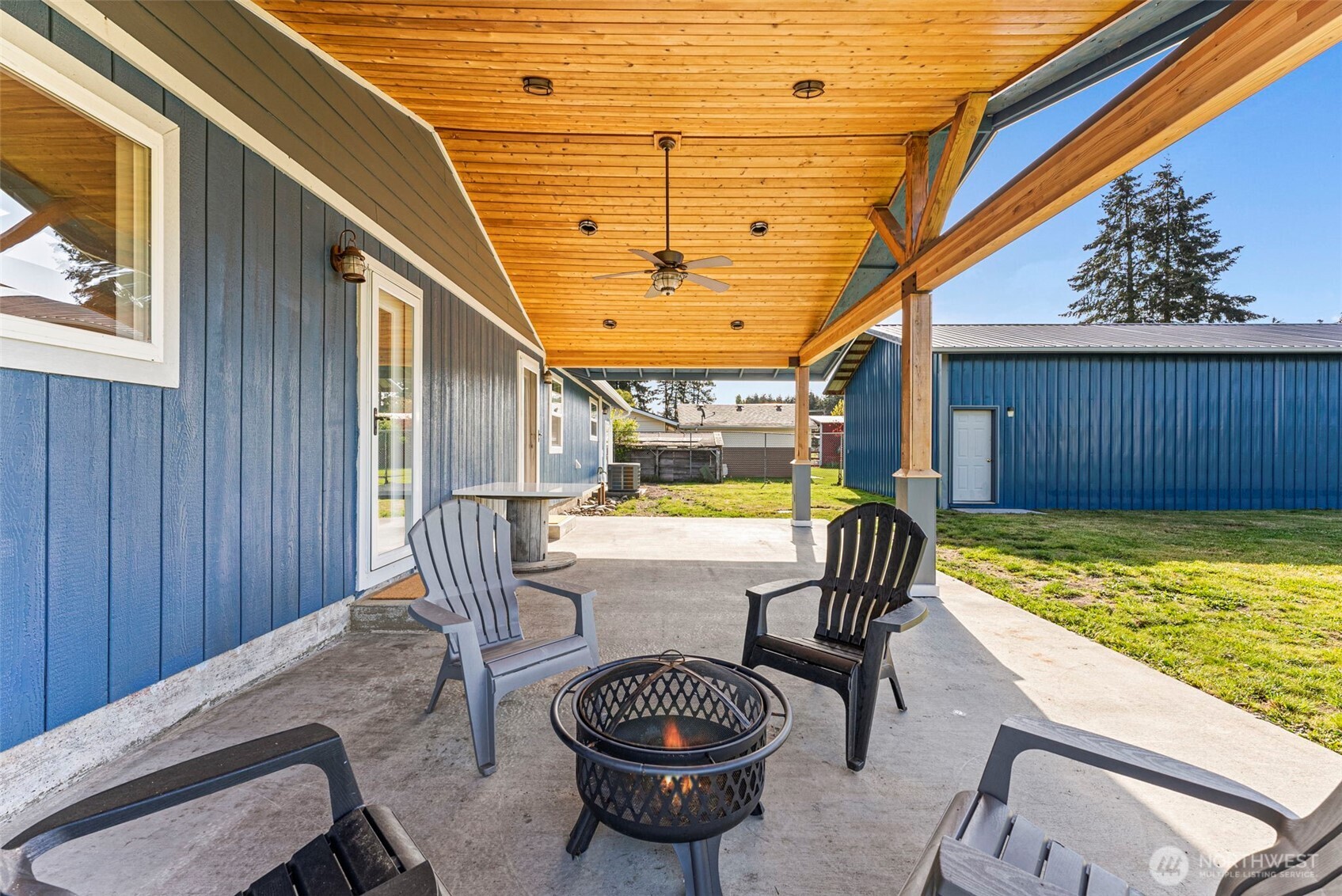 9037 178th Avenue Southwest Rochester, WA 98579 - Photo 24 of 33 a view of a swimming pool with a chairs and table in the patio