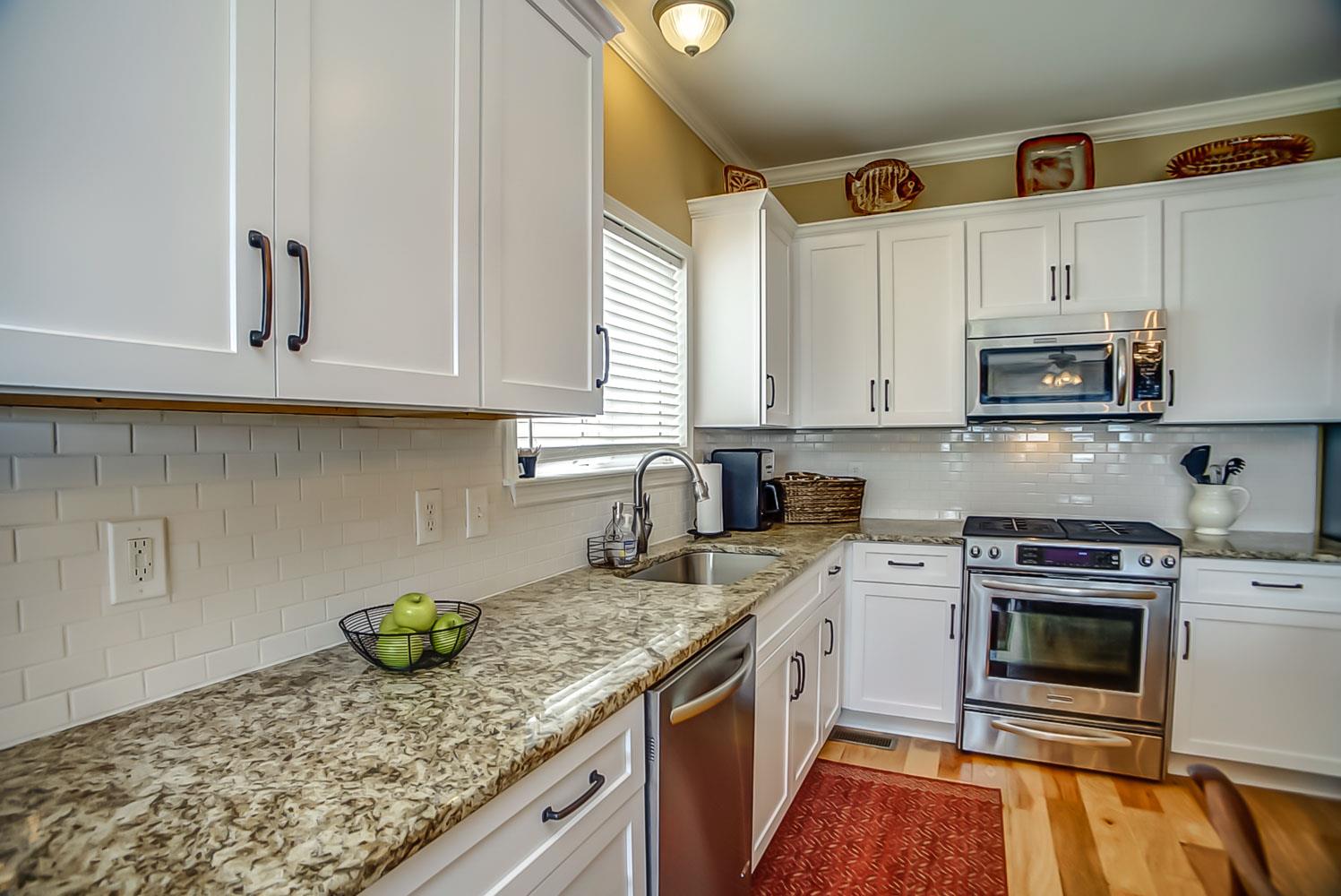 1717 Decatur Circle Franklin, TN 37067 - Photo 7 of 20 Lots of new white cabinets with subway tile backsplash and granite countertops.