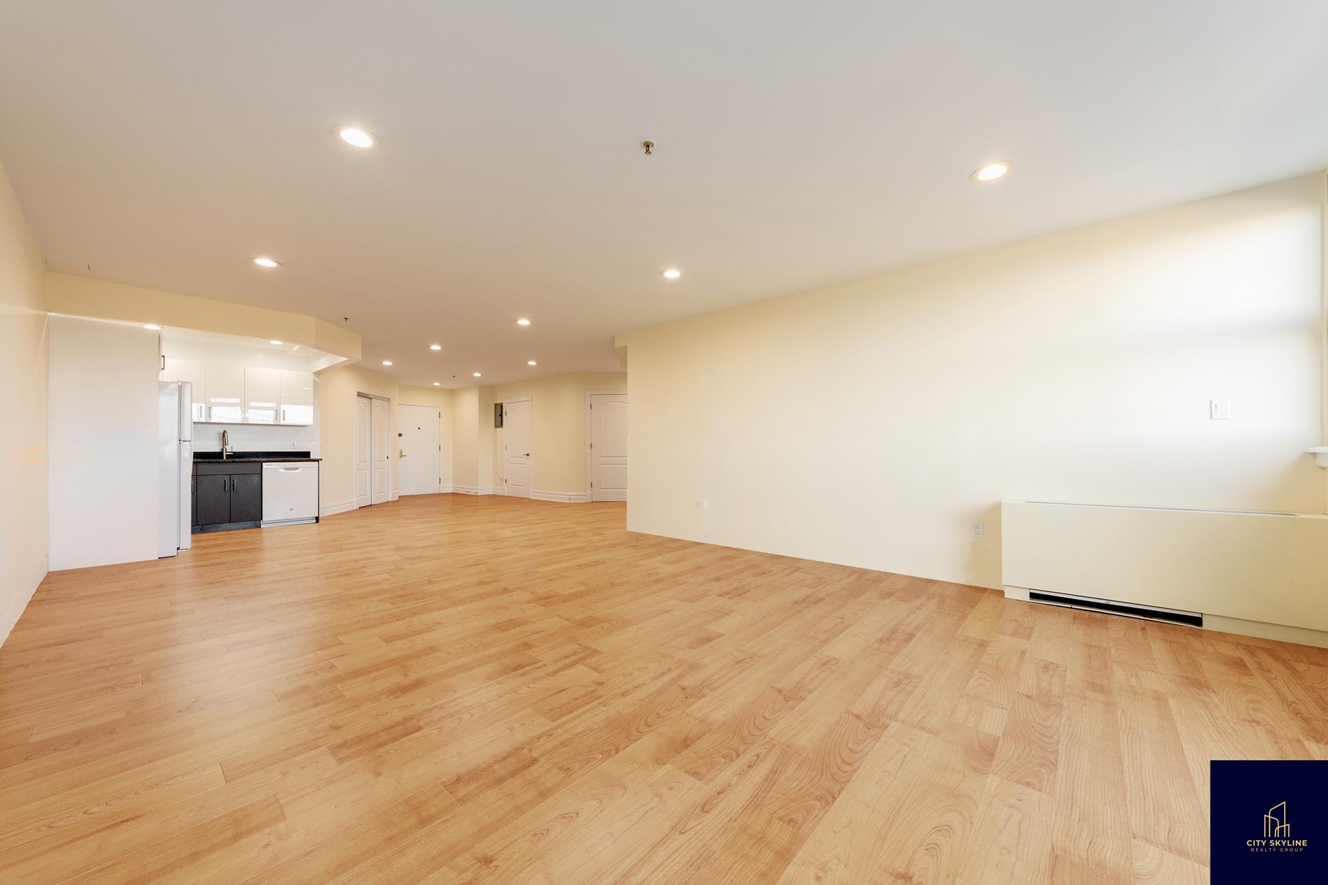 19-19 24th Avenue, Unit L706 Queens, NY 11102 - Photo 10 of 19 a view of empty room with wooden floor