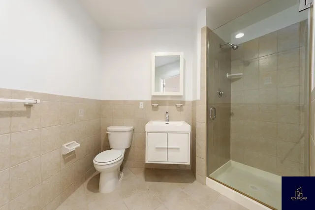 a view of kitchen with refrigerator and window