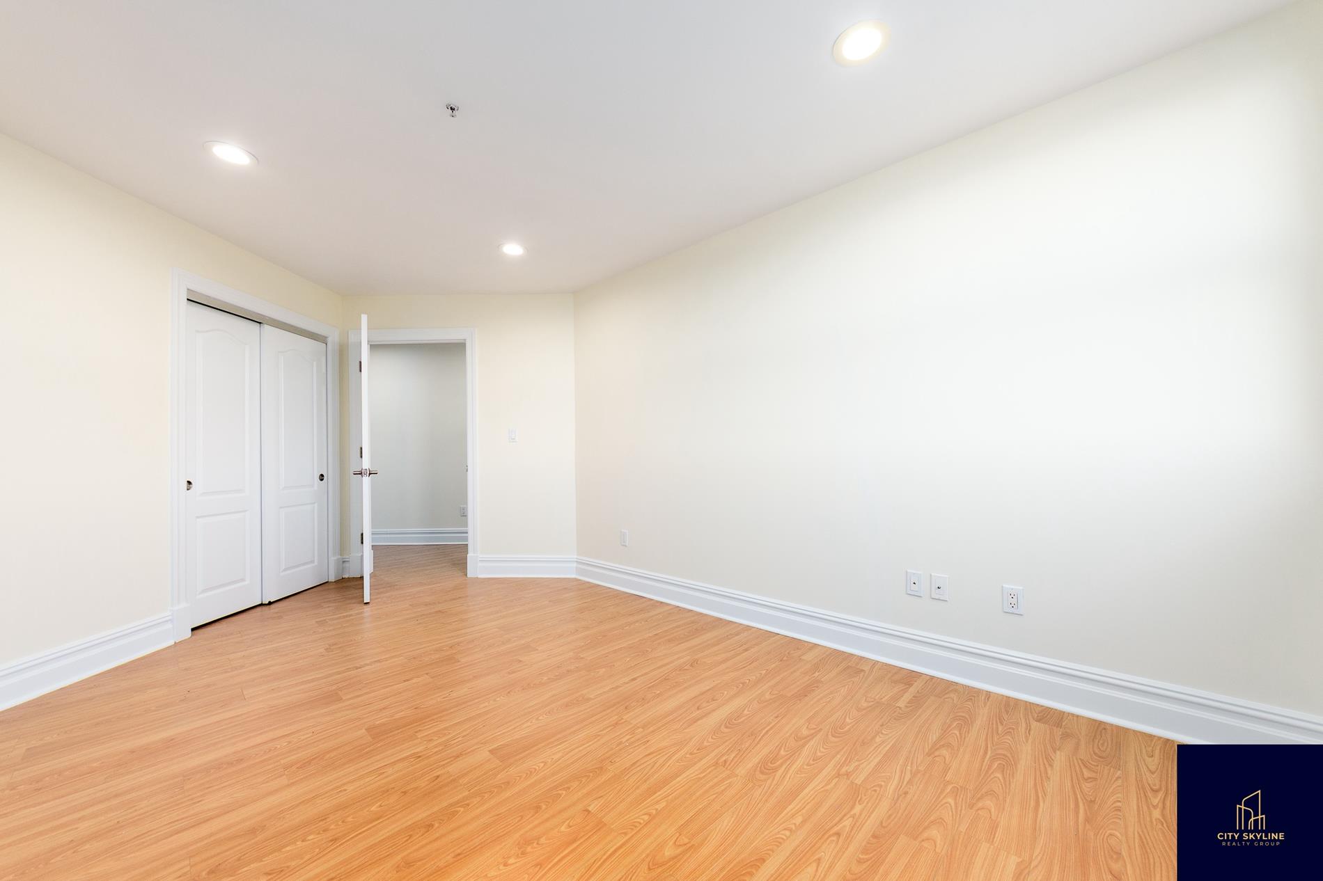 19-19 24th Avenue, Unit L706 Queens, NY 11102 - Photo 13 of 19 wooden floor in a room
