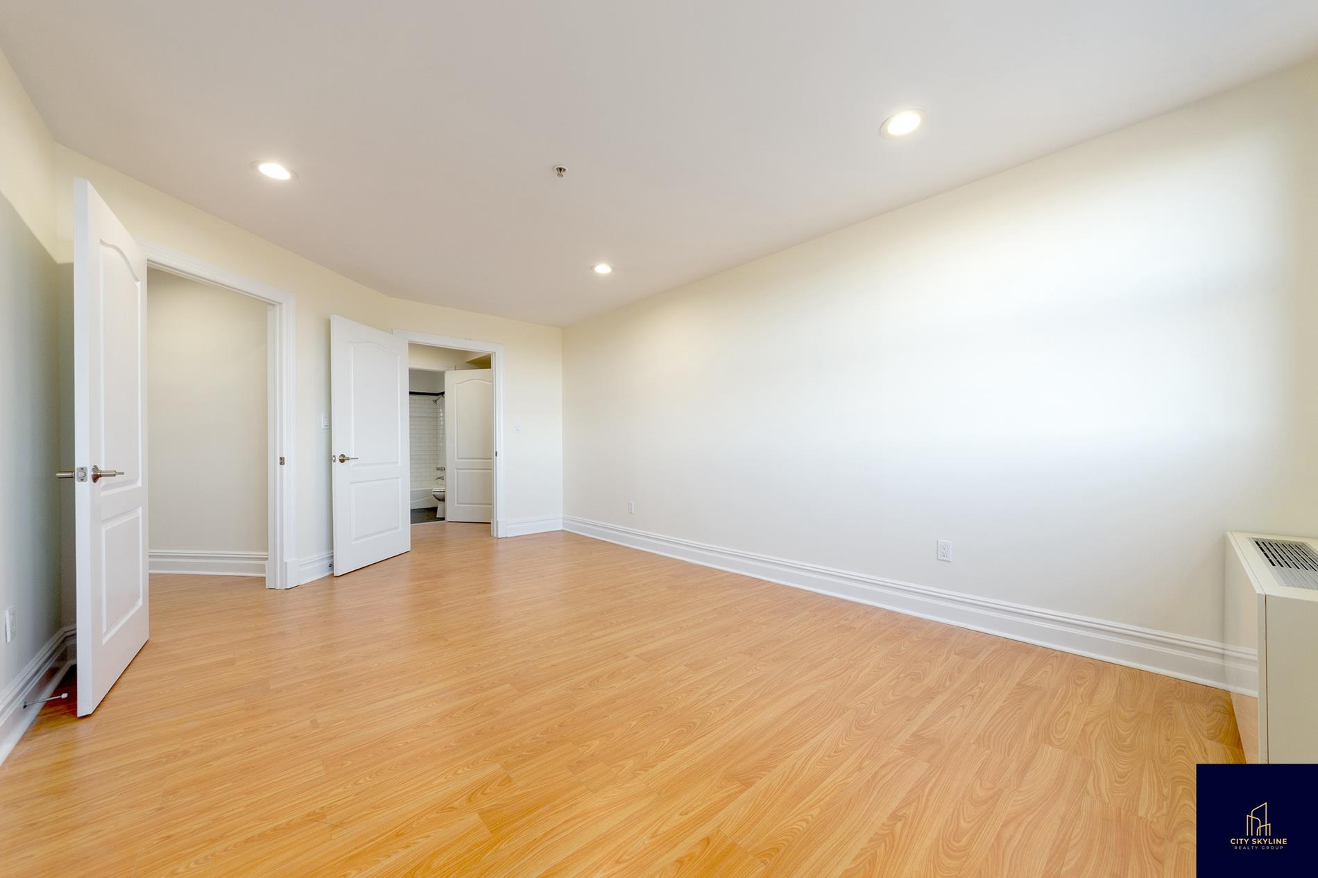 19-19 24th Avenue, Unit L706 Queens, NY 11102 - Photo 16 of 19 a view of an empty room
