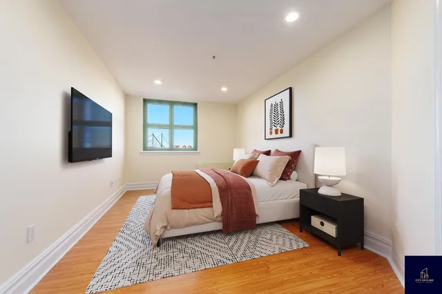 a bedroom with a bed and a window