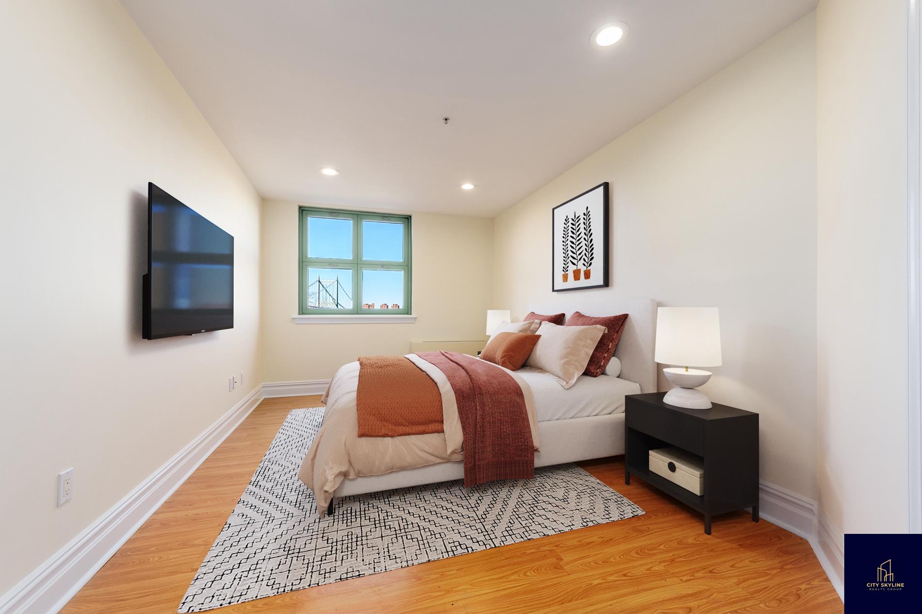 19-19 24th Avenue, Unit L706 Queens, NY 11102 - Photo 6 of 19 a spacious bedroom with a bed and a couch