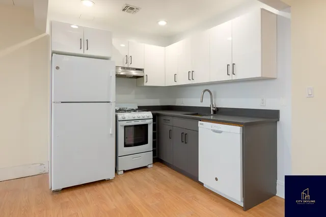 a spacious bedroom with a bed and a couch