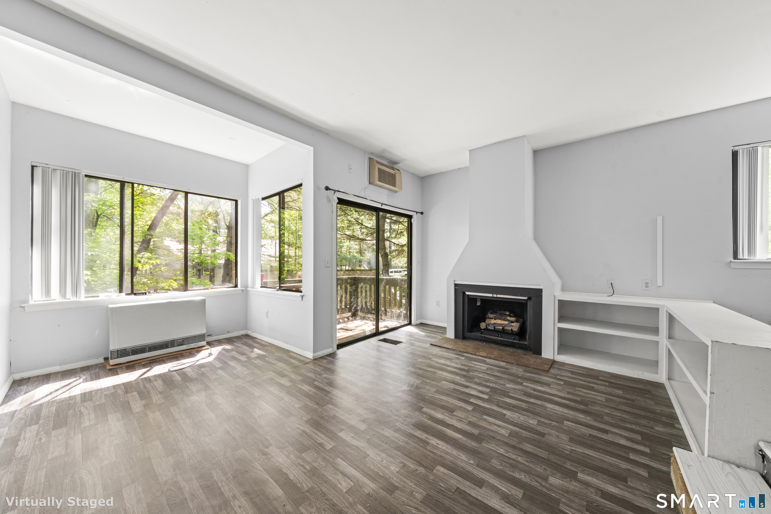 39 Evergreen Road, Unit 39 Torrington, CT 06790 - Photo 25 of 27 a view of living room with furniture and fireplace