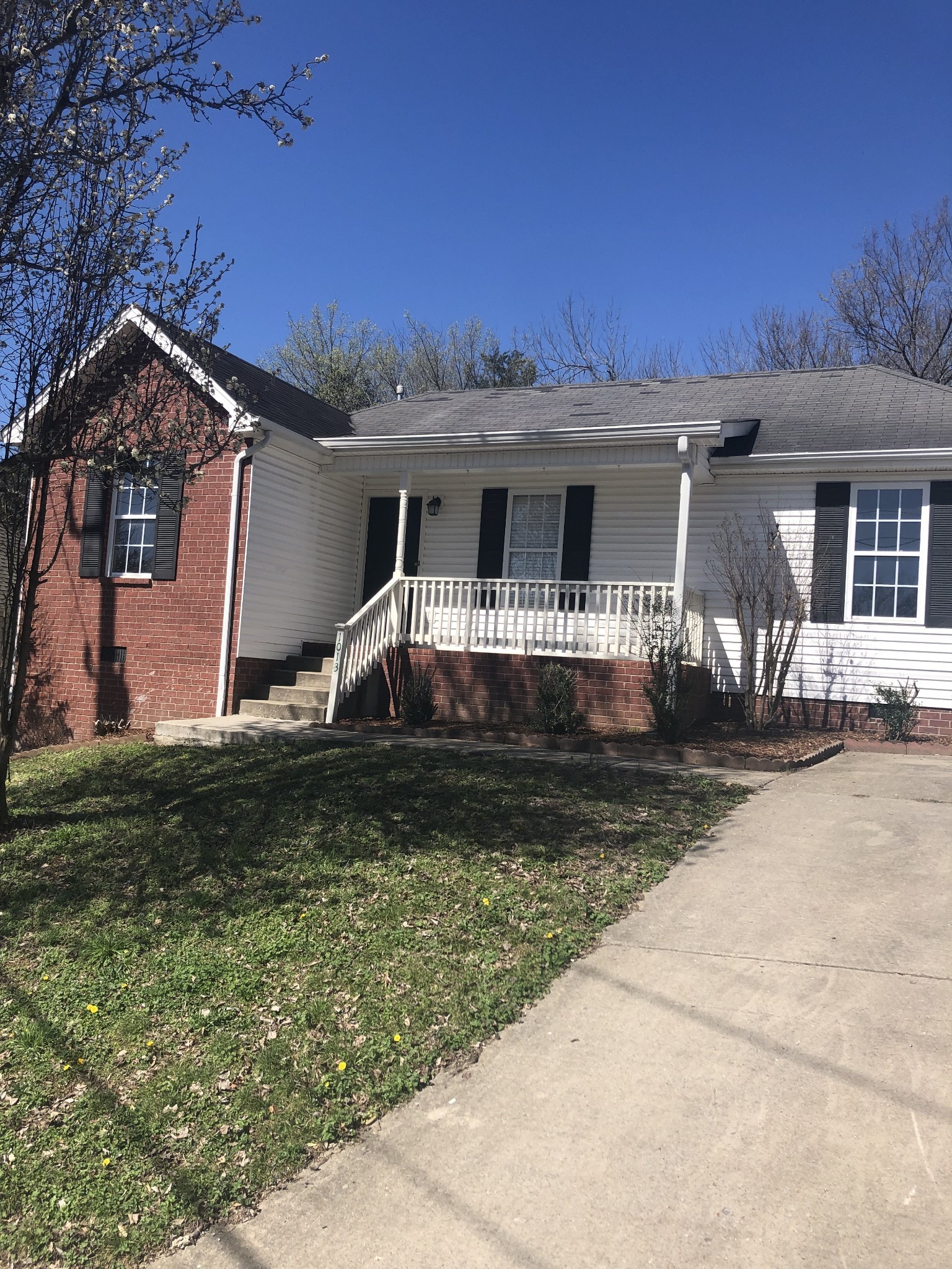 1013 Saddlestone Drive Hermitage, TN 37076 - Photo 1 of 16 front view of a house with a yard