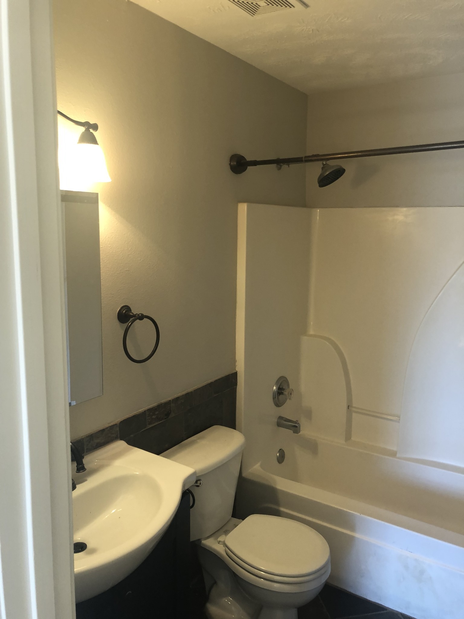 1013 Saddlestone Drive Hermitage, TN 37076 - Photo 11 of 16 a bathroom with a sink a toilet and shower