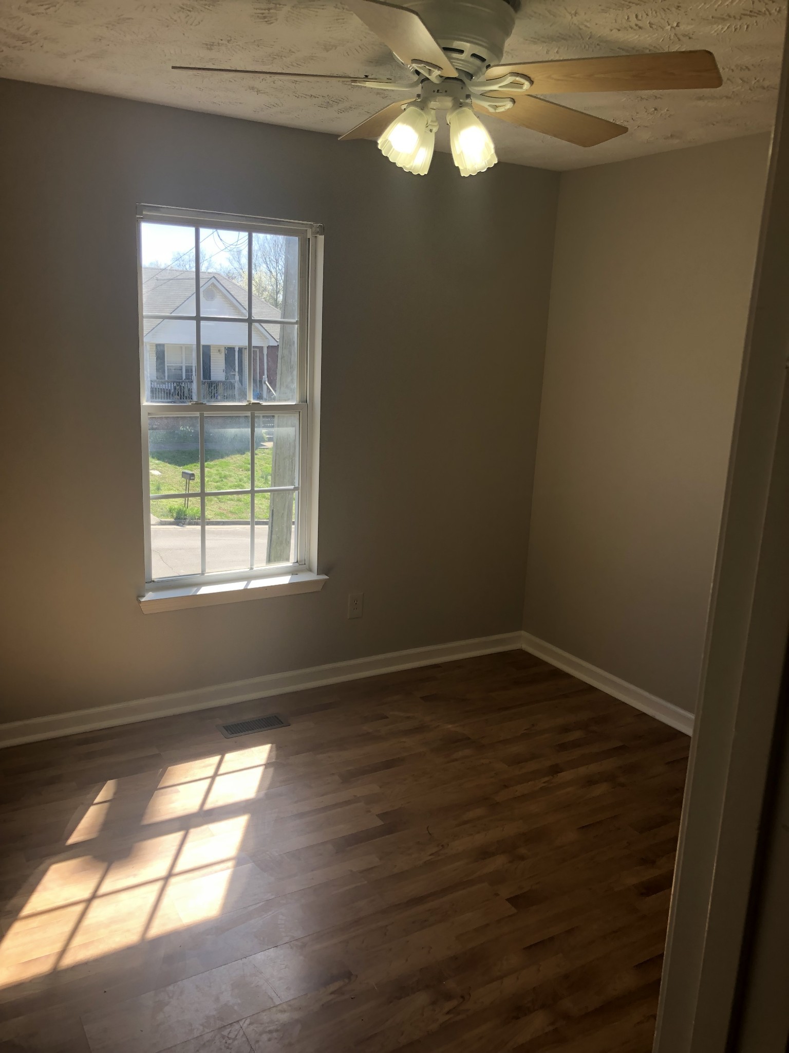 1013 Saddlestone Drive Hermitage, TN 37076 - Photo 13 of 16 a view of empty room with wooden floor and fan