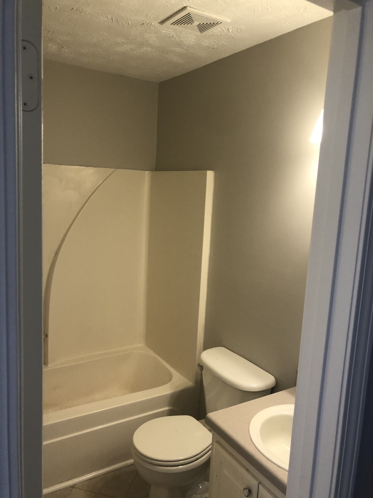 1013 Saddlestone Drive Hermitage, TN 37076 - Photo 14 of 16 a white toilet and tub next to a bathroom sink