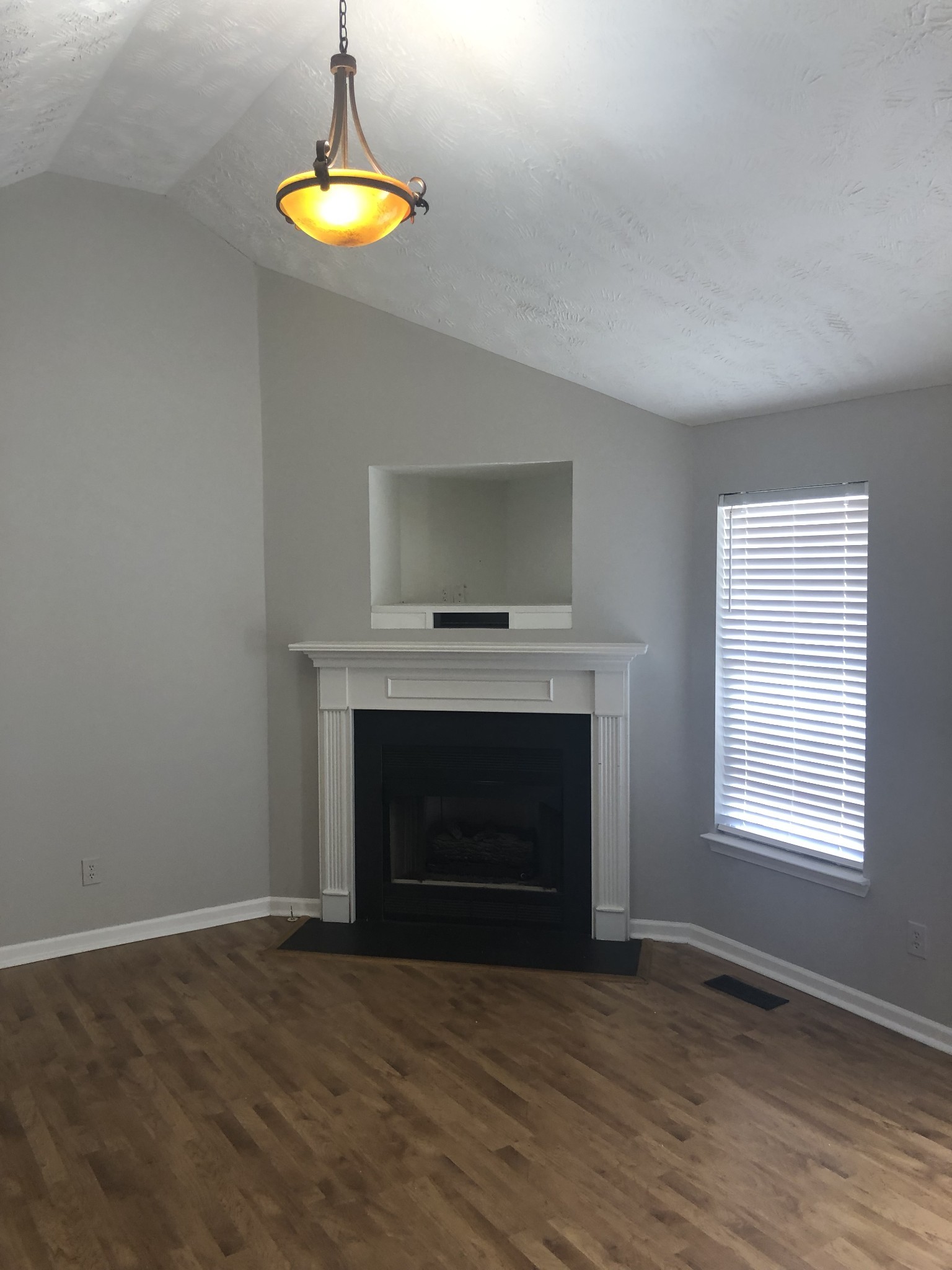 1013 Saddlestone Drive Hermitage, TN 37076 - Photo 2 of 16 a living room with wooden floor and a fireplace