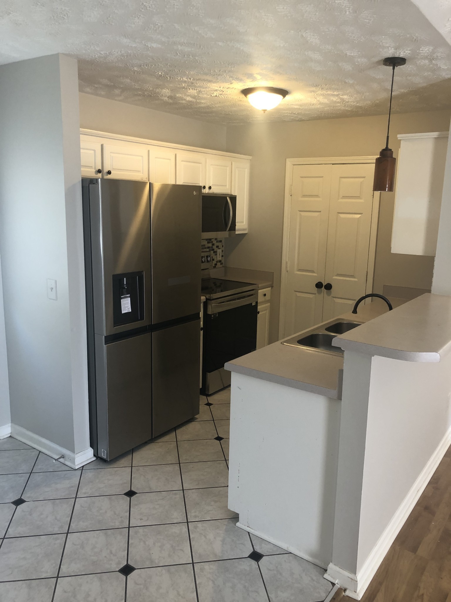 1013 Saddlestone Drive Hermitage, TN 37076 - Photo 4 of 16 a kitchen with a refrigerator and a sink