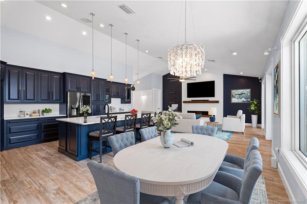 10 Copaire Road Stuart, FL 34996 - Photo 4 of 48 a large kitchen with a table and chairs