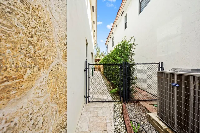 a view of a patio with a table and chairs
