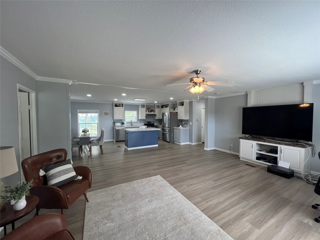 702 Paint Creek Road McDade, TX 78650 - Photo 16 of 40 a view of a livingroom with furniture and a flat screen tv