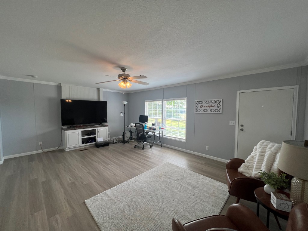 702 Paint Creek Road McDade, TX 78650 - Photo 17 of 40 a living room with furniture and a flat screen tv