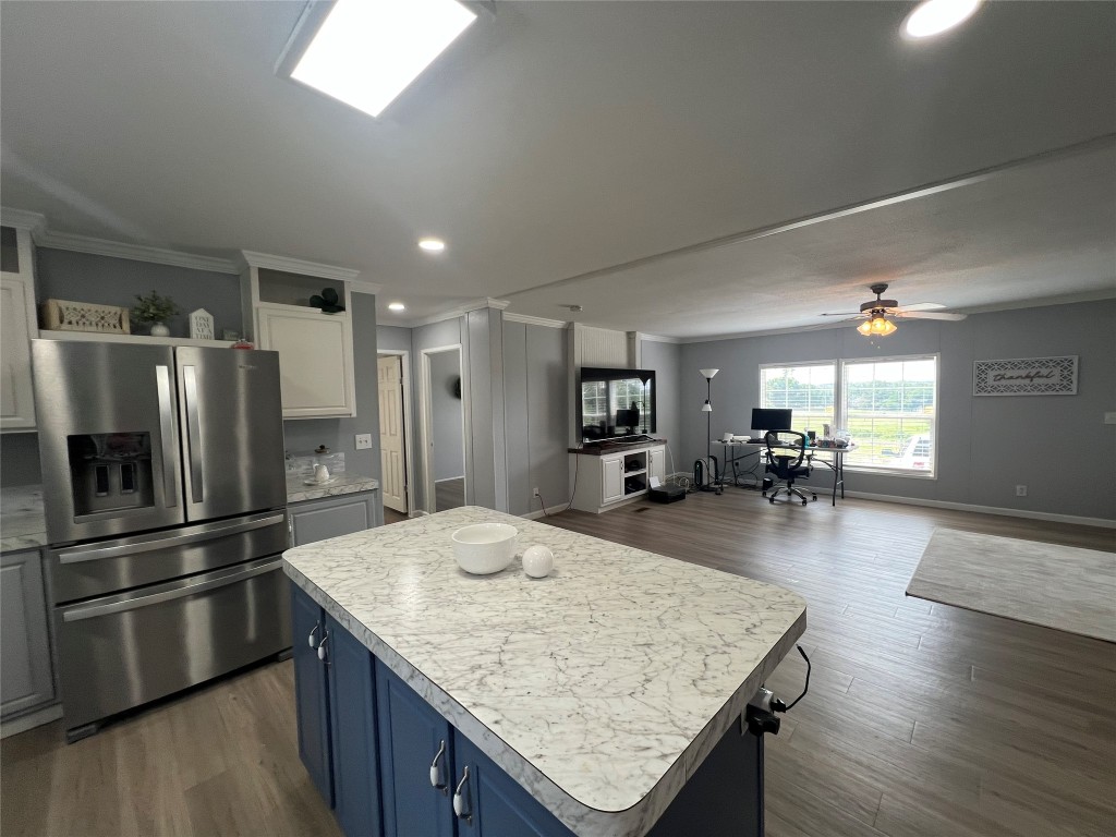702 Paint Creek Road McDade, TX 78650 - Photo 39 of 40 a kitchen with center island and stainless steel appliances