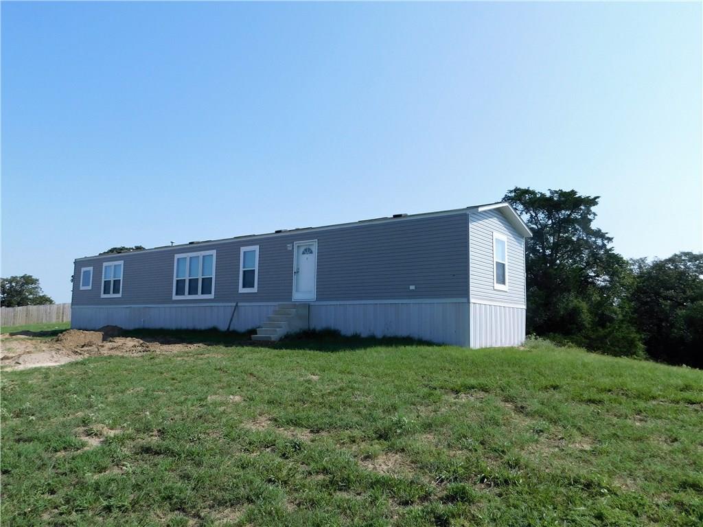 702 Paint Creek Road McDade, TX 78650 - Photo 25 of 40 a view of a house with a yard
