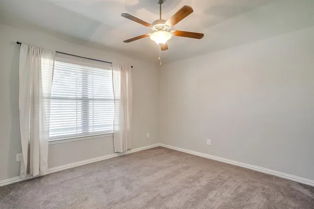 a bathroom with a toilet and bathtub