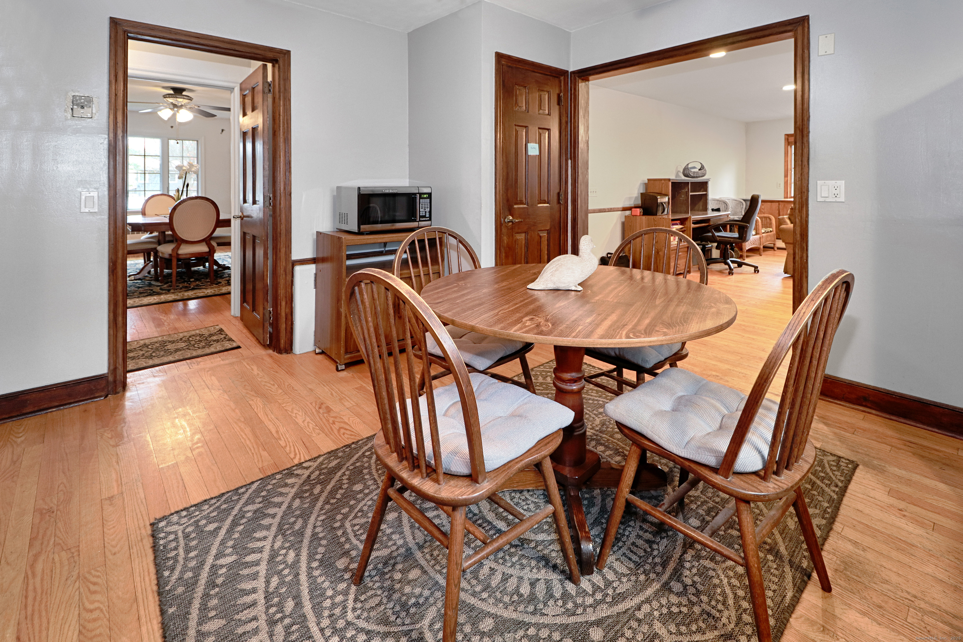 232 Church Hill Road Fairfield, CT 06825 - Photo 11 of 31 a view of a dining room with furniture and wooden floor