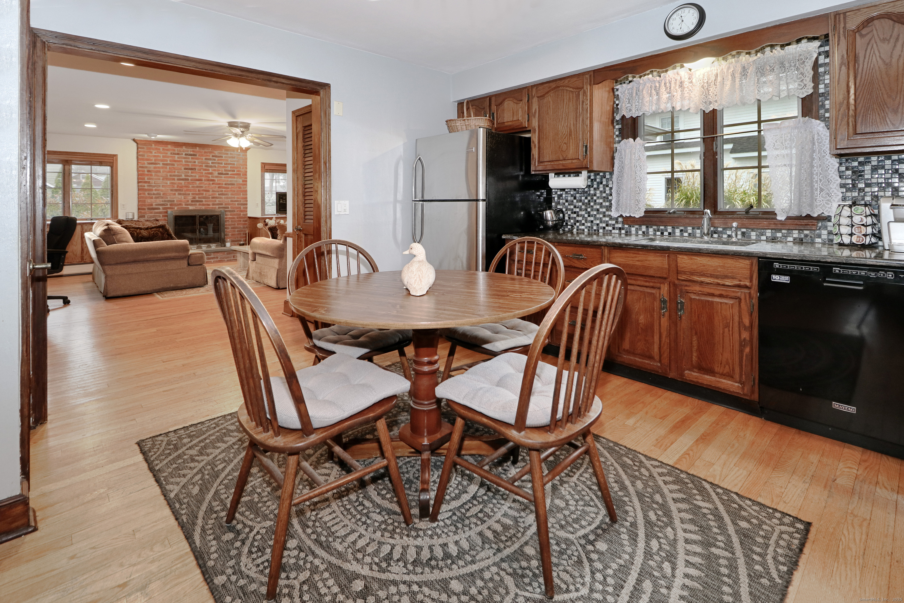 232 Church Hill Road Fairfield, CT 06825 - Photo 12 of 31 a dining room with furniture and wooden floor